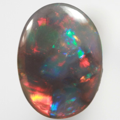 SOLID BLACK OPAL Gemmy fire of red, green and blue SEE VIDEO